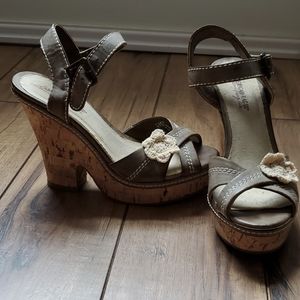 Brown wedges with crocheted flower